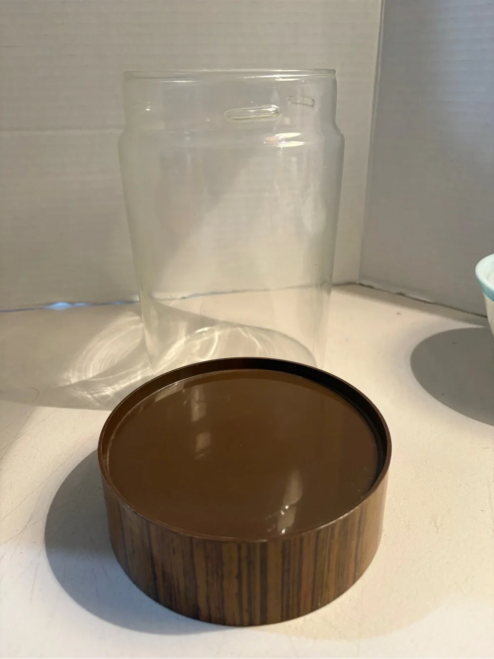 Vintage 1970s Pyrex canister with wood grain lid 7”